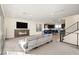 Open-concept living room with fireplace and abundant natural light at 11676 Midnight Melody Ave, Las Vegas, NV 89138