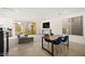 The spacious living room with floor to ceiling windows boasts a fireplace and modern furniture at 11676 Midnight Melody Ave, Las Vegas, NV 89138