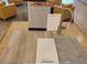 Close-up of interior design materials, featuring flooring samples, cabinetry, and fixture finish options at 1529 Little Penguin St, Las Vegas, NV 89138