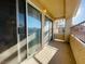 Covered balcony features railings and sliding glass doors at 1881 W Alexander Rd # 2117, North Las Vegas, NV 89032