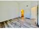 A bright bedroom with wood-look floors, ensuite bathroom, and ample closet space provides a comfortable retreat at 1881 W Alexander Rd # 2117, North Las Vegas, NV 89032