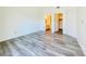 A bright bedroom with wood-look floors, ensuite bathroom, and walk-in closet provides a comfortable retreat at 1881 W Alexander Rd # 2117, North Las Vegas, NV 89032