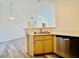 Open kitchen with breakfast bar and stainless steel dishwasher at 1881 W Alexander Rd # 2117, North Las Vegas, NV 89032