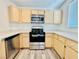 Modern kitchen with stainless steel appliances, light wood cabinets and countertops at 1881 W Alexander Rd # 2117, North Las Vegas, NV 89032