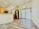 Bright kitchen with wood floors, stainless steel appliances and sliding glass door at 1881 W Alexander Rd # 2117, North Las Vegas, NV 89032