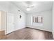 Bright bedroom featuring wood floors, ceiling fan, and a window nook at 1911 Hobson Dr, Henderson, NV 89074