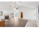 Open-concept living area with fireplace, ceiling fan, and ample natural light at 1911 Hobson Dr, Henderson, NV 89074
