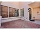 Private patio area with brick pavers, windows, and stucco exterior at 1911 Hobson Dr, Henderson, NV 89074