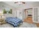 Cozy bedroom featuring a large window, traditional decor, and doorway leading to living area at 2073 Sapphire Valley Ave, Henderson, NV 89074