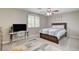 Bright bedroom with a comfortable bed, desk with computer, and a window with shutters at 2073 Sapphire Valley Ave, Henderson, NV 89074
