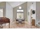 Bright dining room featuring tall ceilings, wood floors, and shuttered windows at 2073 Sapphire Valley Ave, Henderson, NV 89074