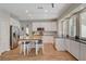 Beautiful kitchen with white cabinets, granite countertops, and a breakfast table at 2073 Sapphire Valley Ave, Henderson, NV 89074