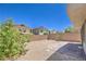 The cozy backyard has desert landscaping, is fully fenced, and has a brick patio at 2300 Sky Island Dr, Henderson, NV 89002