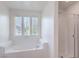 Bathroom with a soaking tub, shower, and large windows at 2300 Sky Island Dr, Henderson, NV 89002