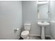 Clean powder room featuring a pedestal sink, tile floor, and neutral paint at 2300 Sky Island Dr, Henderson, NV 89002