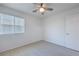 Well-lit bedroom with carpet and a ceiling fan offering a comfortable and inviting space at 2300 Sky Island Dr, Henderson, NV 89002