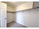 Walk-in closet with carpet flooring and open shelving at 2300 Sky Island Dr, Henderson, NV 89002