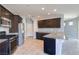 Modern kitchen with stainless steel appliances, dark cabinets, and granite countertops at 2300 Sky Island Dr, Henderson, NV 89002