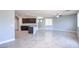 Open living area featuring a kitchen bar and dark cabinetry at 2300 Sky Island Dr, Henderson, NV 89002