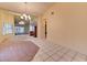 Bright dining room with carpeted area and a mirrored wall, creating an open feel at 2352 Pickwick Dr # 85, Henderson, NV 89014