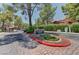 Community entrance showcasing 'The Village Green' signage and well-maintained landscaping at 2352 Pickwick Dr # 85, Henderson, NV 89014