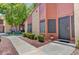 Charming townhouse exterior with a well-maintained garden, walkway, and stylish front door at 2352 Pickwick Dr # 85, Henderson, NV 89014