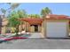 Townhouse exterior with carport, desert landscaping, and visible address number at 2352 Pickwick Dr # 85, Henderson, NV 89014