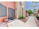 Inviting front door with security screen and well-maintained landscaping leading to the home at 2352 Pickwick Dr # 85, Henderson, NV 89014