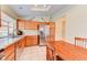 Another view of the bright kitchen, showcasing stainless appliances and an adjacent dining area at 2352 Pickwick Dr # 85, Henderson, NV 89014