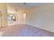 Living room featuring tile flooring, carpet flooring, and neutral walls with great lighting at 2352 Pickwick Dr # 85, Henderson, NV 89014