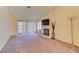 Comfortable living room with fireplace, large windows, and sliding doors offering natural light at 2352 Pickwick Dr # 85, Henderson, NV 89014