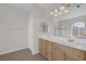 Bathroom featuring double sinks, and view of shower stall at 2405 Esteem Ridge Dr, Henderson, NV 89052