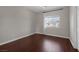Bedroom with hardwood floors and a large window providing natural light at 2405 Esteem Ridge Dr, Henderson, NV 89052