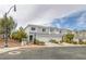 Inviting townhome featuring a two-car garage and a well-maintained, landscaped yard at 2405 Esteem Ridge Dr, Henderson, NV 89052