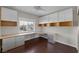 Home office with custom built-in cabinets and drawers offering plenty of storage at 2405 Esteem Ridge Dr, Henderson, NV 89052