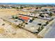 Expansive aerial view of the property with a red tile roof and a fenced-in yard with desert landscaping at 2801 Peggy Ave, Pahrump, NV 89048