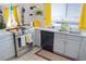 Bright kitchen features stainless steel appliances, white cabinets, and a window offering natural light at 2801 Peggy Ave, Pahrump, NV 89048