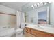 Bright bathroom featuring a single sink vanity and a shower-tub combo at 2983 Juniper Hills Blvd # 102, Las Vegas, NV 89142