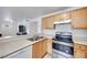 Kitchen features stainless steel appliances and light wood cabinets at 2983 Juniper Hills Blvd # 102, Las Vegas, NV 89142