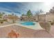 Community pool surrounded by rock and lush greenery, offering a peaceful retreat for residents at 2983 Juniper Hills Blvd # 102, Las Vegas, NV 89142