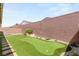 Wide shot of backyard with artificial turf and putting green at 3391 Stone View Ave, Henderson, NV 89044