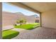 Beautiful backyard with artificial turf, stone pavers, and a putting green for outdoor enjoyment at 3391 Stone View Ave, Henderson, NV 89044