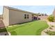 This backyard features an artificial turf putting green, perfect for outdoor recreation and entertainment at 3391 Stone View Ave, Henderson, NV 89044