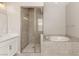 Bright bathroom with a walk-in shower and a soaking tub at 3391 Stone View Ave, Henderson, NV 89044