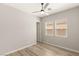 Well-lit bedroom featuring neutral walls, wood-look floors, and a ceiling fan for added comfort at 3391 Stone View Ave, Henderson, NV 89044