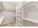 Spacious walk-in closet with custom shelving and wood flooring at 3391 Stone View Ave, Henderson, NV 89044