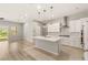 Modern kitchen with island, stainless steel appliances, and access to the private courtyard at 3391 Stone View Ave, Henderson, NV 89044
