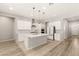 Stylish kitchen featuring white cabinetry, stainless steel appliances, and a functional center island at 3391 Stone View Ave, Henderson, NV 89044