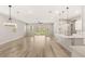Bright, open-concept living area with hardwood floors and sliding glass doors to a private courtyard at 3391 Stone View Ave, Henderson, NV 89044
