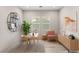 Staged office with stylish decor, including a modern desk, chair, shelving, and artwork at 3391 Stone View Ave, Henderson, NV 89044